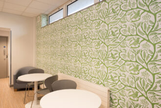 Green on white Rowan design wallpaper by artist Alison Milner