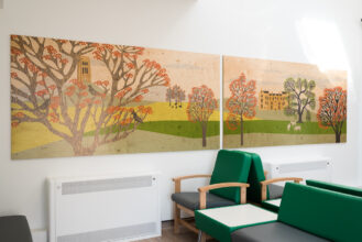 Glastonbury Tor and Montacute House behind orange blossom trees printed on ply