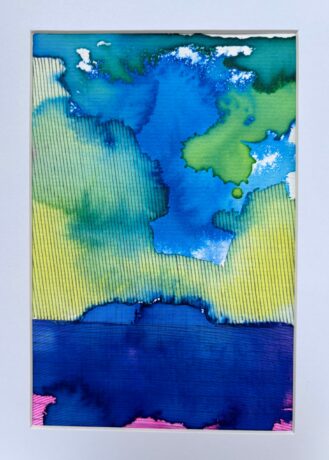Vivid blue, green and yellow skies over a blue Steep Holm island