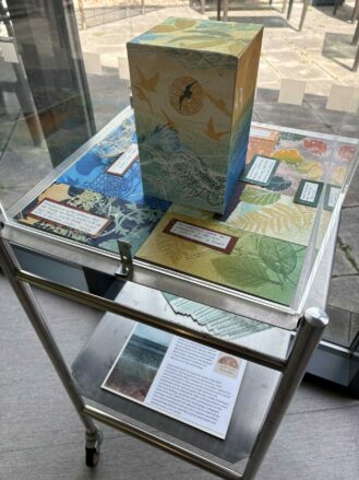 Jackie Curtis's print works in an acrylic box