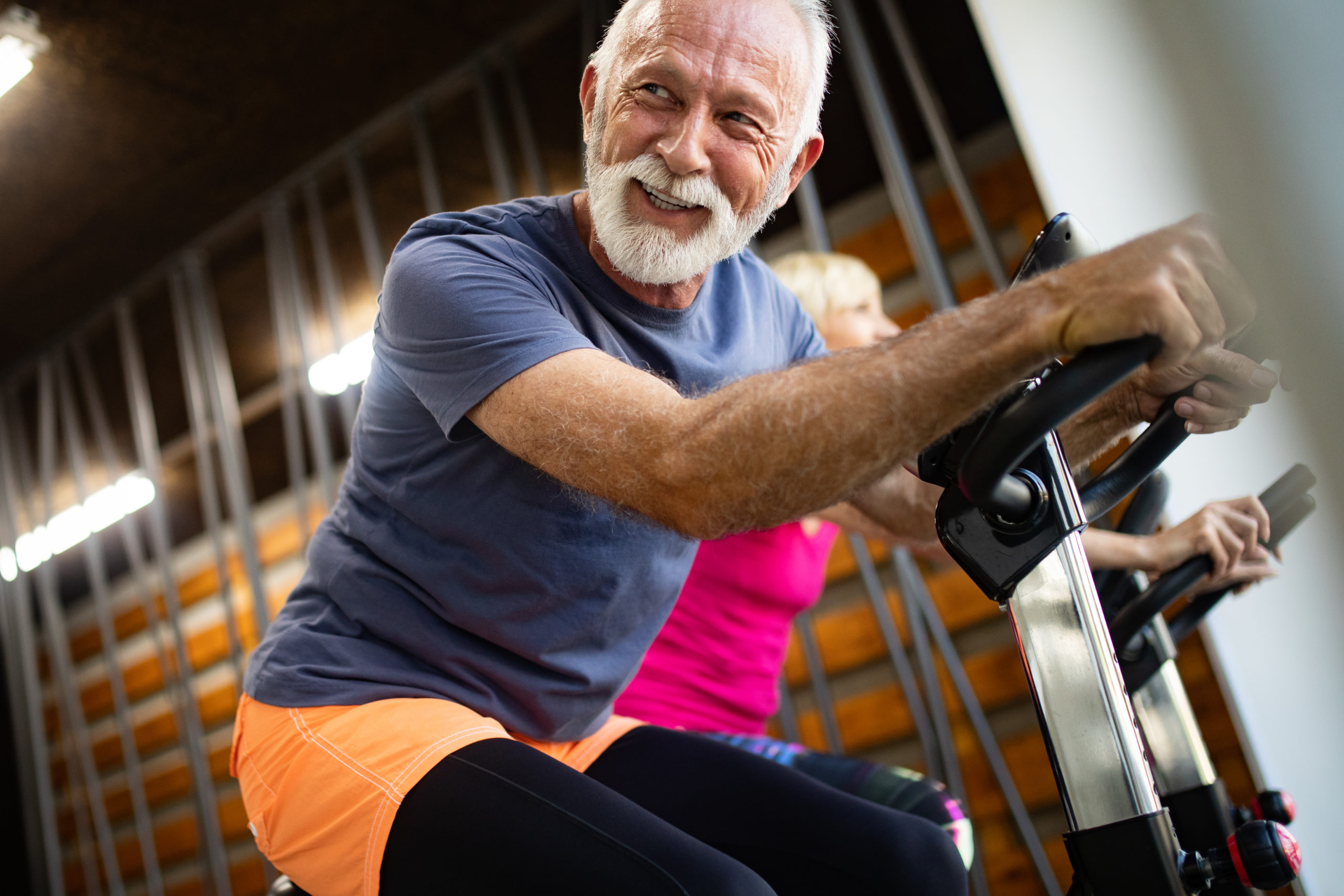 Senior sitting on a stationary bicycle