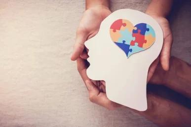 a wooden head with a love heart as a brain