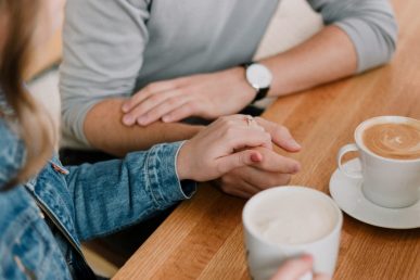 Two Adults Talking Over Tea
