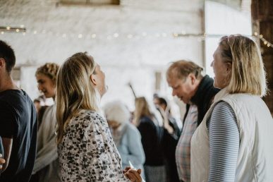 a group of older adults standing and talking together