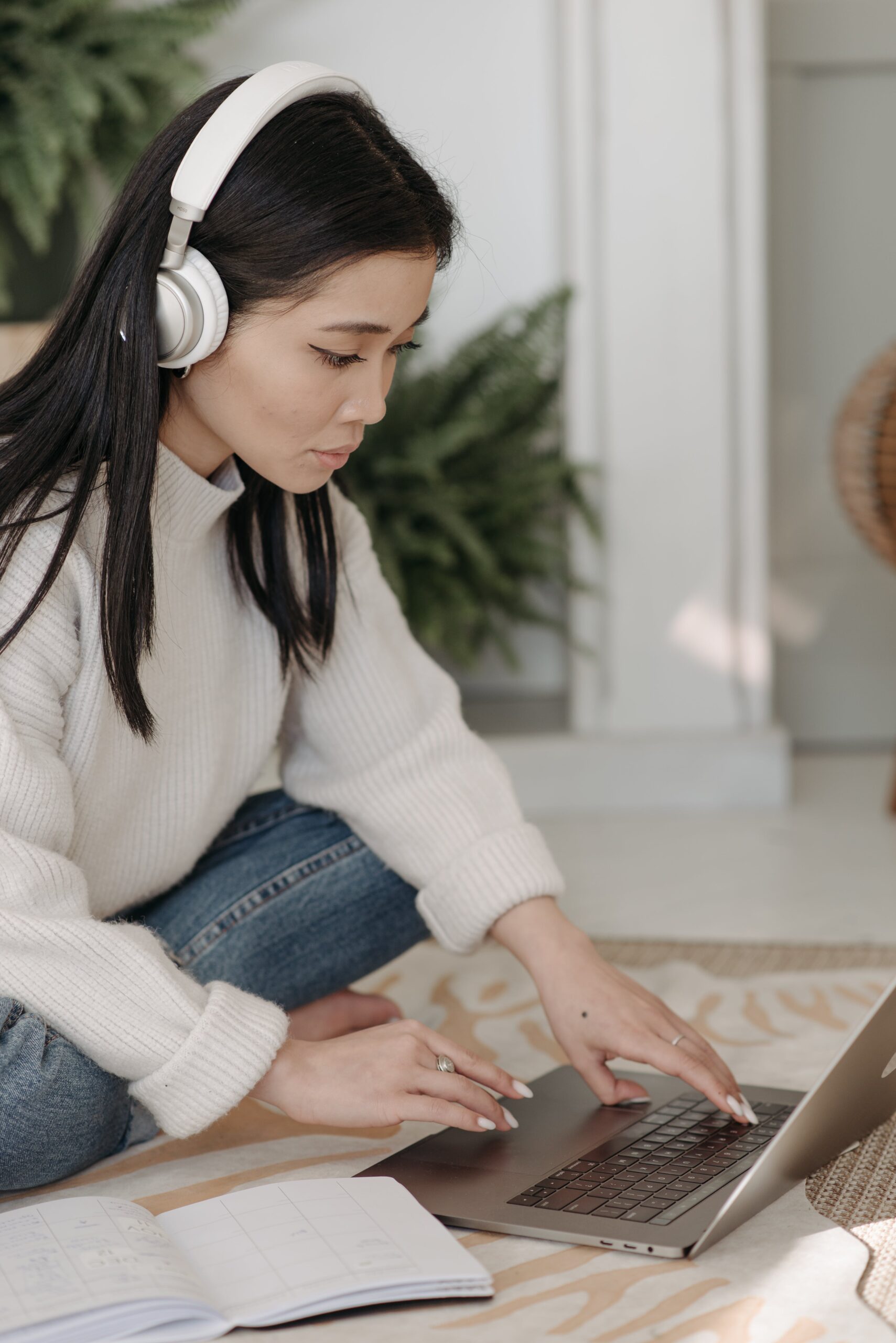 lady listening to a podcast through her headphones