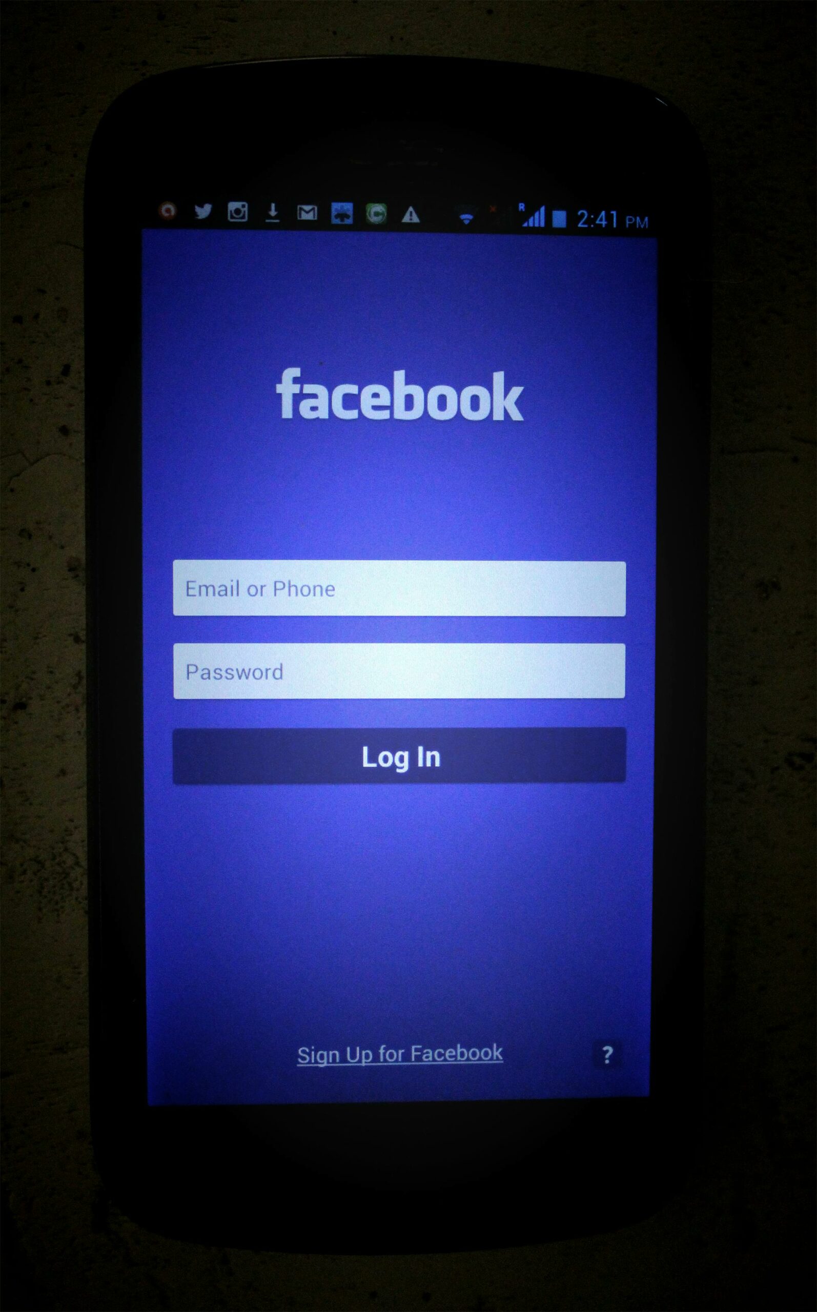 mobile phone screen displaying the facebook login page