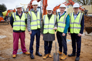 A photo of five colleagues at Somerset NHS Foundation Trust, including chief executive Peter Lewis., standing on the Yeovil Diagnostic Centre building site