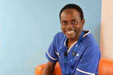 A photo of nurse Oluwafemi Alo sat on a chair at the Williton Hospital stroke unit.