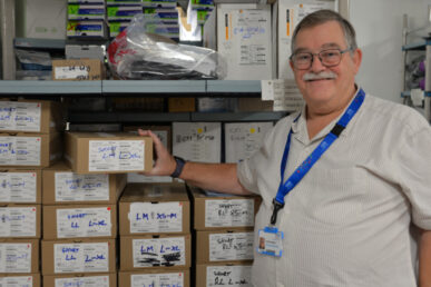 Reservist Kevin Boseley standing next to stock in the orthotics department at Musgrove Park Hospital.