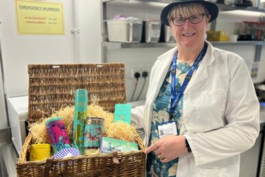 A photo of Amanda Vickery, a catering manager at Musgrove Park Hospital, holding a hamper that she won as part of a national awards ceremony.