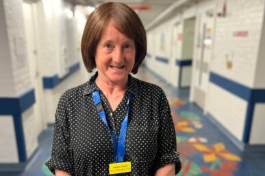 A photo of nurse Helen Perfitt stood in the children's unit corridor at Musgrove Park Hospital.