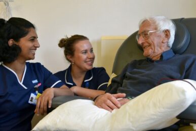 A photo of two cancer care nurses with a patient at Williton Hospital's chemotherapy unit.