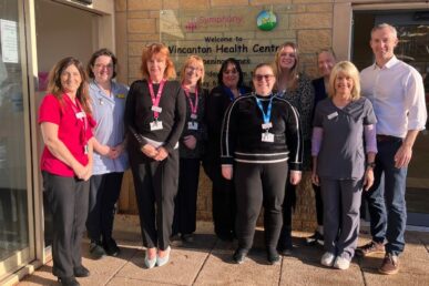 Colleagues at Wincanton Health Centre stood outside the health centre building.
