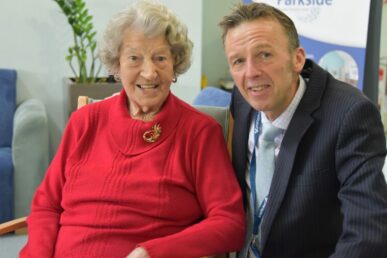 A photo of surgeon Ben Bolland with a 102 year old patient who he performed a hip operation on.