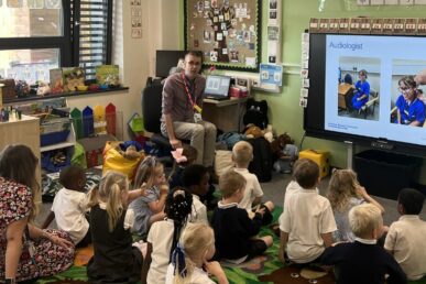 A photo of children at a primary school in Taunton, alongside our future careers facilitator, Mark.