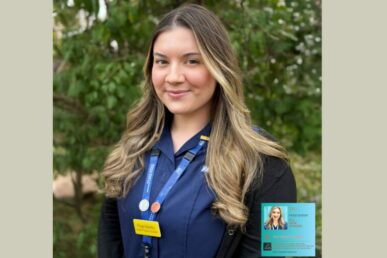 A photo of nursing associate Paige Barsby stood outside in a green area.