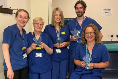 Five colleagues from Musgrove Park Hospital's cardiology department holding awards they've won.