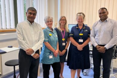 A photo of colleagues from the ophthalmology team at Yeovil Hospital stood in a treatment room.