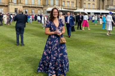A photo of specialist epilepsy nurse Emma Christie stood in the garden of Buckingham Palace.