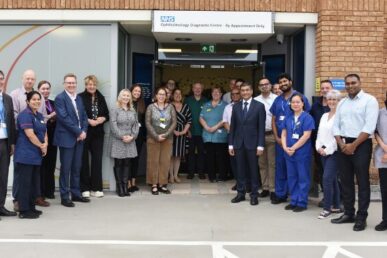 A group of people stood in front of the Yeovil ophthalmology diagnostic centre in the Quedam shopping mall.