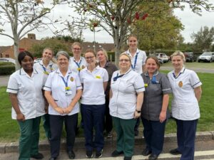 People from the West Somerset based integrated community stroke service stood next to trees.
