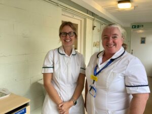 People from the Mendip based integrated community stroke service stood in a hospital corridor.