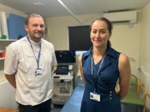 Two colleagues from our post-menopausal bleeding service stood in a clinic room at Wellington Hospital.