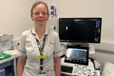 A photo of sonographer Alice Bevan in a radiology reporting room.