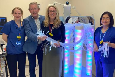 A photo of three colleagues from Musgrove Park Hospital's cardiology department and League of Friends president Clinton Rogers holding a paediatric sensory machine.