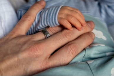 Picture of a parent and baby's hand