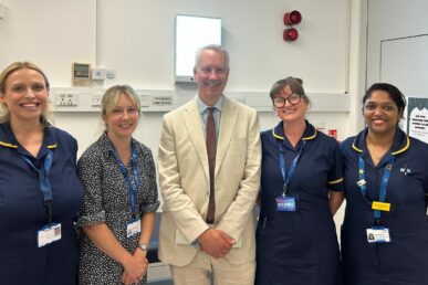A photo of four faster diagnosis nurses stood in a clinic room with Taunton and Wellington Member of Parliament Gideon Amos.