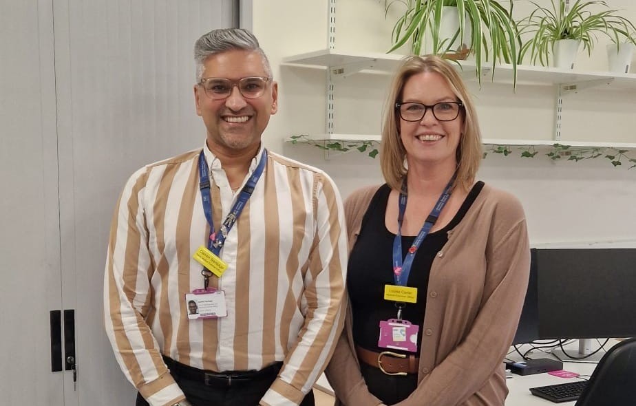 Two colleagues from the bereavement team at Yeovil Hospital stood in a room.