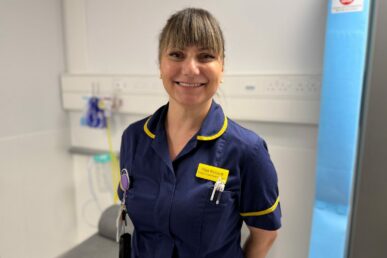 A photo of nurse Olga Richardt stood in a clinic room.