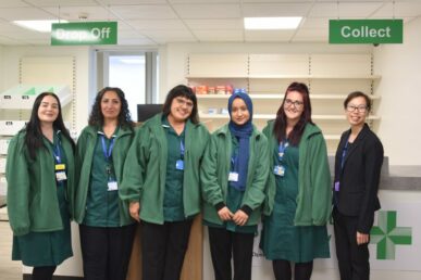Pharmacists line up in front of the new outpatient pharmacy shop front at Musgrove Park Hospital