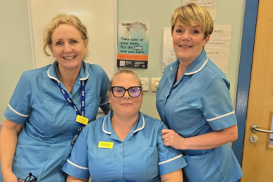 A photo of three colleagues from our audiology service at Yeovil Hospital in light blue uniforms.